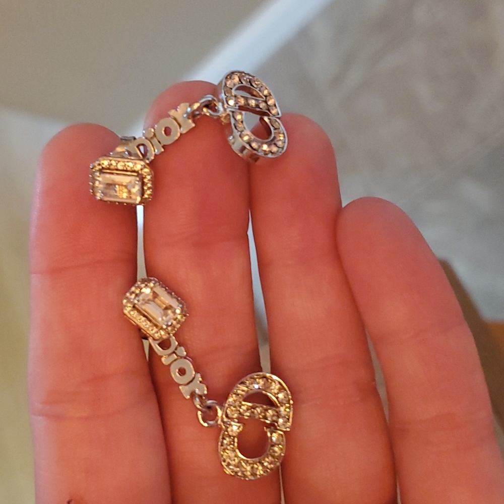Dior dangle earrings with rhinestones on the dior logo